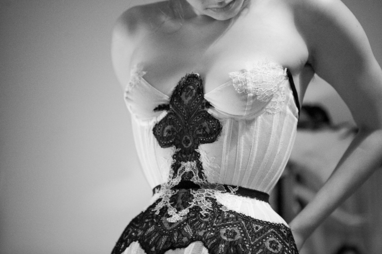 Cupped bobbinet corset overlaid with carefully cut and hand stitched Victorian lace appliqué. Design by Karolina 