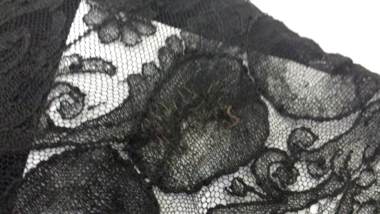 A hand repair on a piece of lace - the colour of the threads used has faded over time. Victorian chantilly lace from the collection of Karolina Laskowska
