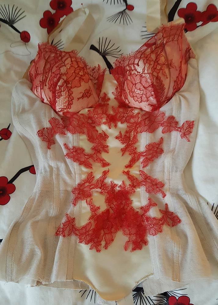 Being impatient and playing with lace placement before the corset was even sewn together (the cups are just pinned in here). Photo by Karolina Laskowska