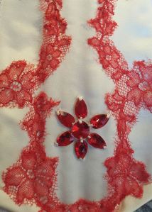 The ill-fated Swarovskis sewn on at 2am. The subsequent removal damaged the silk slightly underneath which was then covered with more lace appliqué. At the end of the second day of lace stitching. Photo by Karolina Laskowska